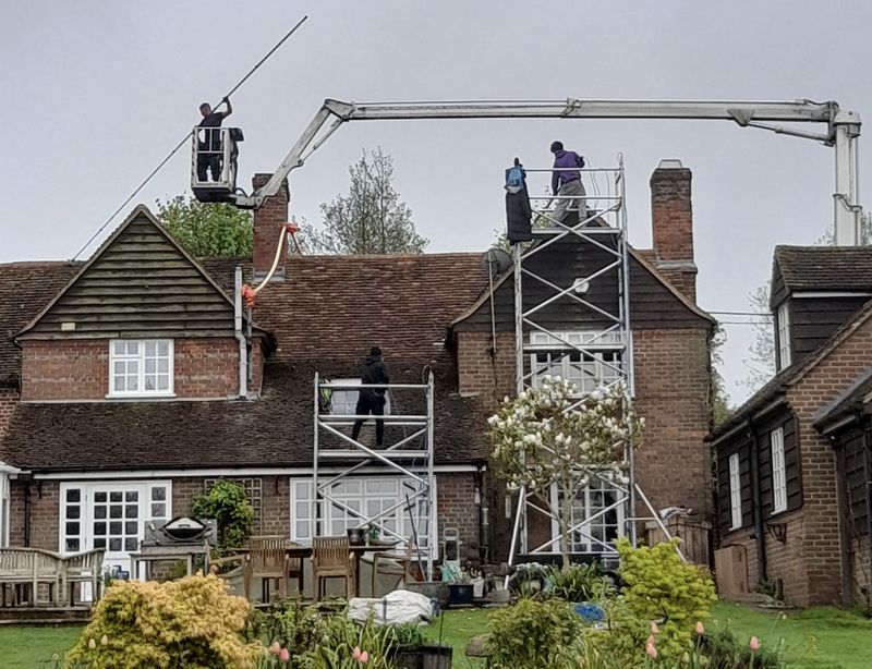 The Moss Cleaners using cherry picker and scaffolding to clean roof safely and professionally in 8 Canbury Park Rd, Kingston upon Thames KT2 6JX, UK, 8 Canbury Park Rd, Kingston upon Thames KT2 6JX, UK